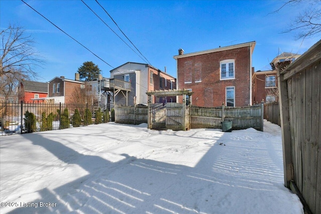 view of yard layered in snow