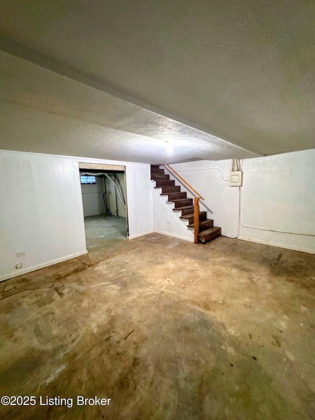 basement with a textured ceiling