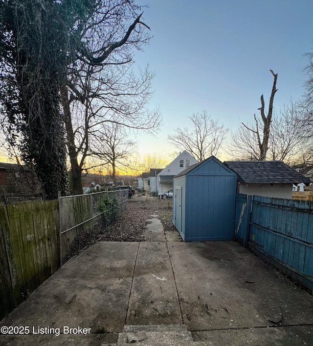 patio terrace at dusk with a shed