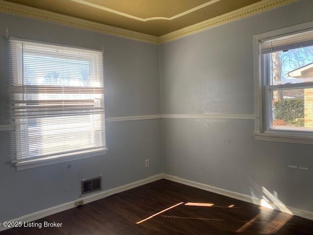 unfurnished room with dark hardwood / wood-style flooring and crown molding