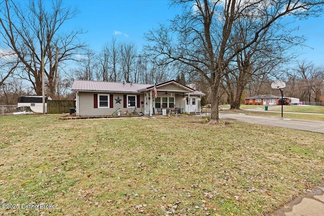 ranch-style house featuring a porch and a front yard