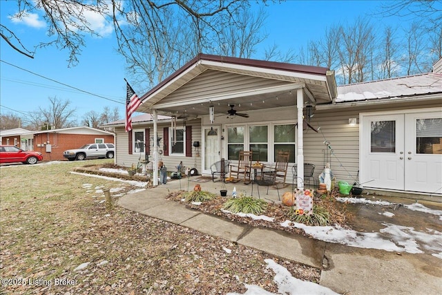 back of house with french doors, ceiling fan, and a patio area