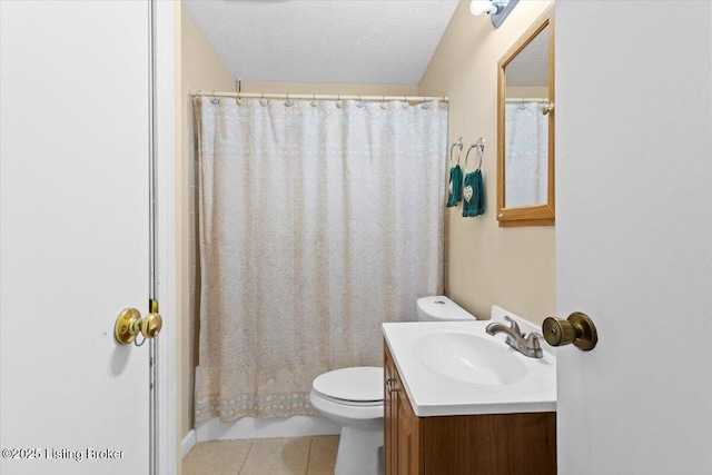 bathroom featuring toilet, a textured ceiling, vanity, a shower with shower curtain, and tile patterned flooring