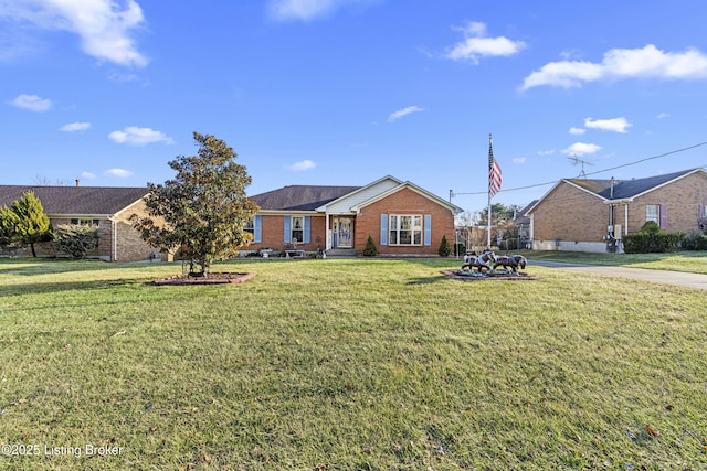 single story home featuring a front lawn and brick siding