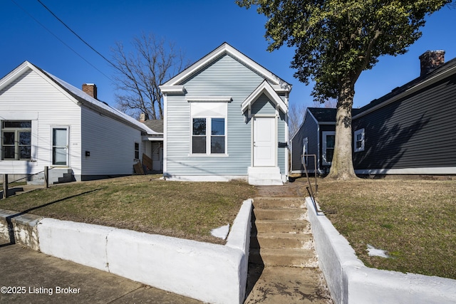 view of front of property with a front lawn