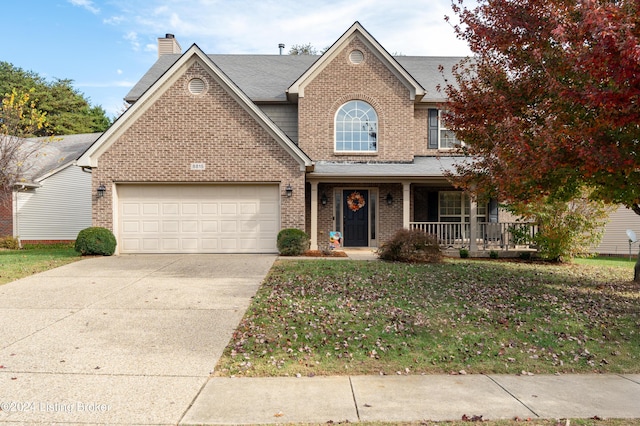 view of front of property with a porch and a front yard