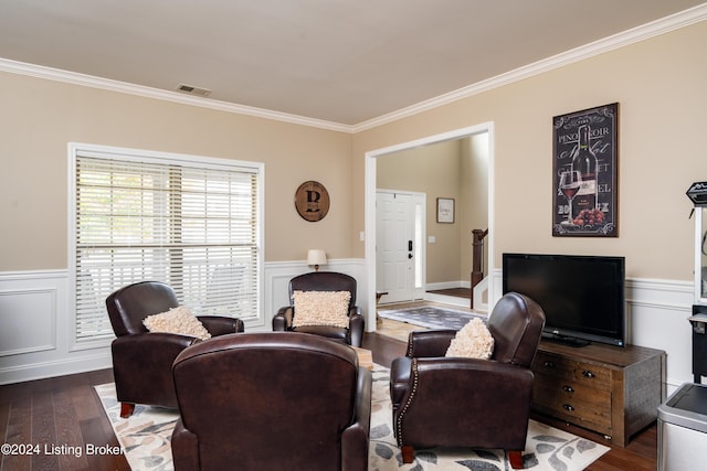 living room with dark hardwood / wood-style floors and crown molding