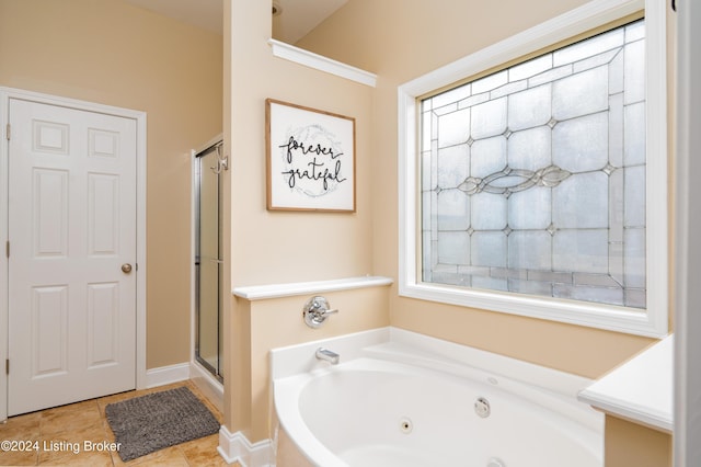 bathroom featuring separate shower and tub and tile patterned flooring