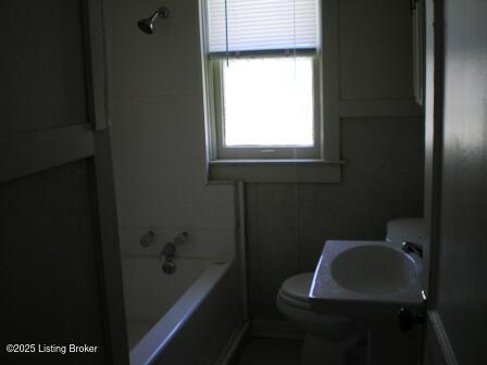 bathroom featuring toilet and sink