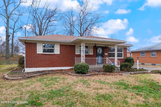 view of front of house featuring covered porch and a front yard