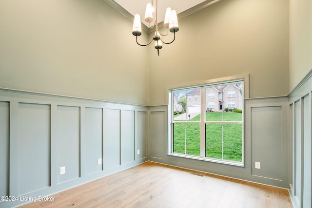 interior space with a chandelier and light wood-type flooring