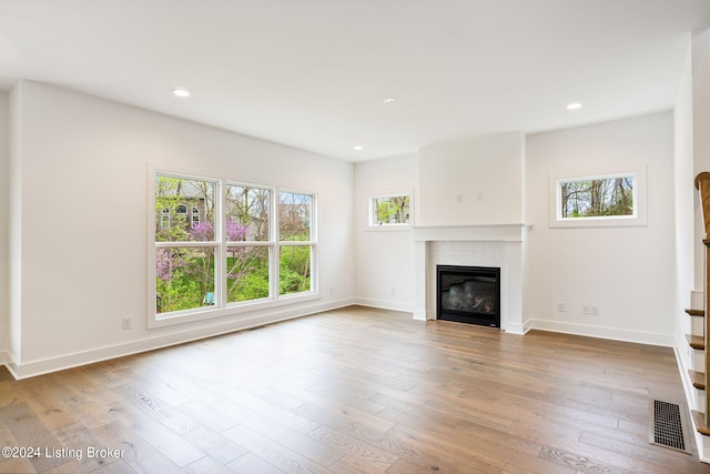 unfurnished living room featuring light hardwood / wood-style flooring