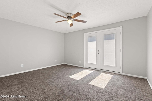 carpeted spare room featuring french doors, ceiling fan, and a textured ceiling