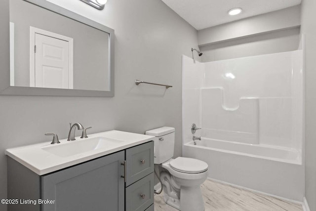 full bathroom featuring vanity, toilet, and bathing tub / shower combination