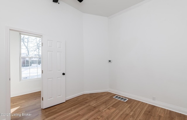 empty room with light hardwood / wood-style flooring