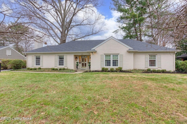 ranch-style home with a front lawn