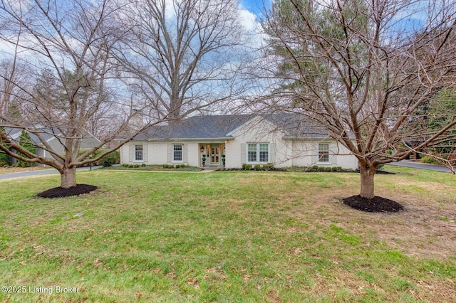 single story home featuring a front lawn