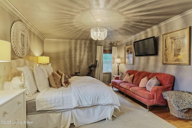 bedroom featuring a chandelier, ornamental molding, and hardwood / wood-style floors