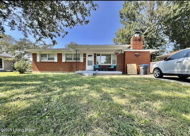 ranch-style house with a porch and a front yard