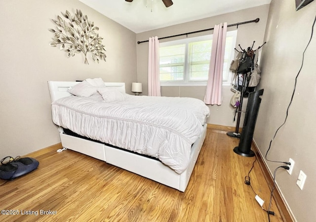 bedroom featuring ceiling fan and light hardwood / wood-style flooring