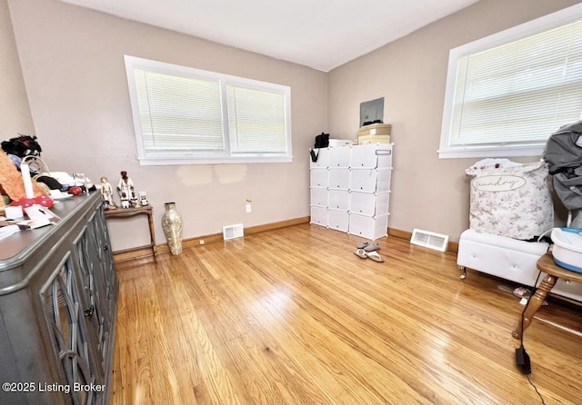 sitting room featuring light hardwood / wood-style floors