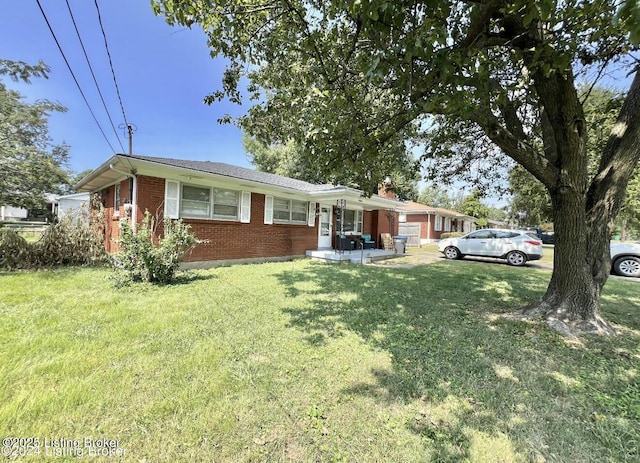 single story home with a front yard