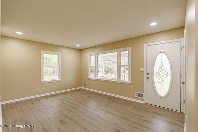 foyer entrance with light hardwood / wood-style flooring