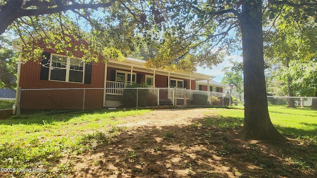 rear view of house with a yard