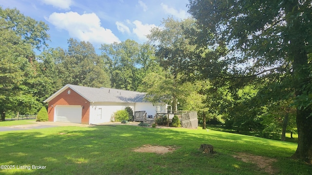 ranch-style home featuring a garage and a front yard