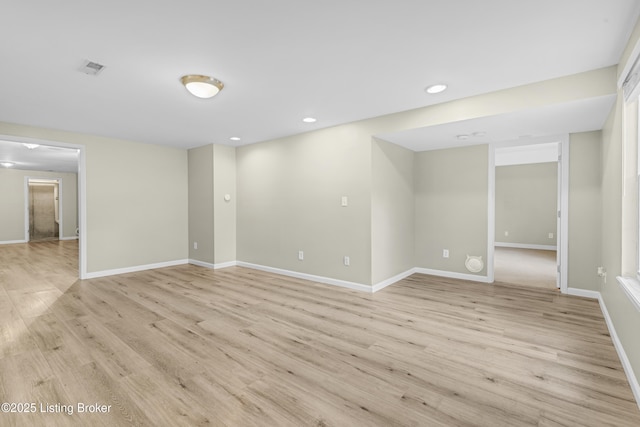 spare room featuring light hardwood / wood-style flooring