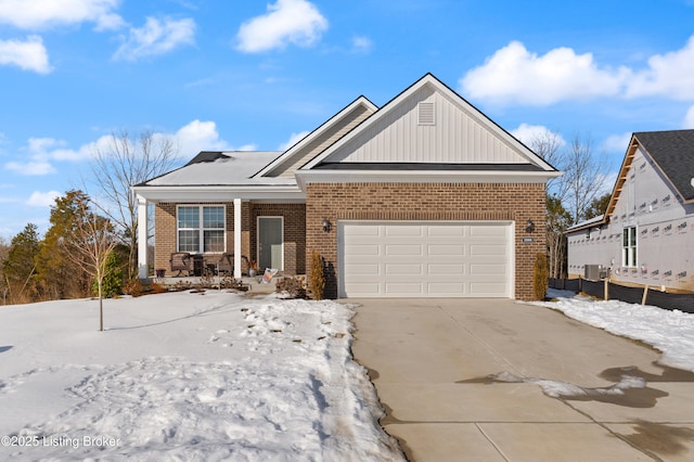 view of front of home featuring a porch and a garage