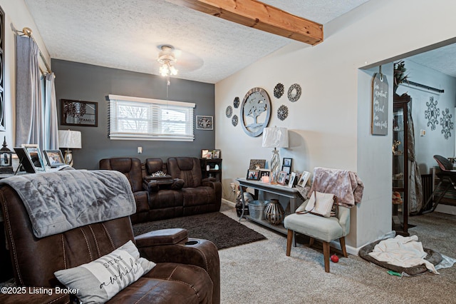 living room featuring a textured ceiling, carpet, and beam ceiling