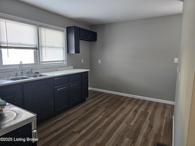 kitchen featuring sink and dark hardwood / wood-style floors