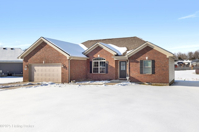 single story home featuring a garage