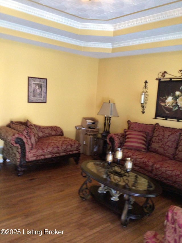 living room featuring crown molding and wood-type flooring