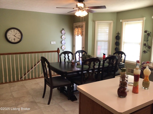 dining area featuring ceiling fan and a wealth of natural light