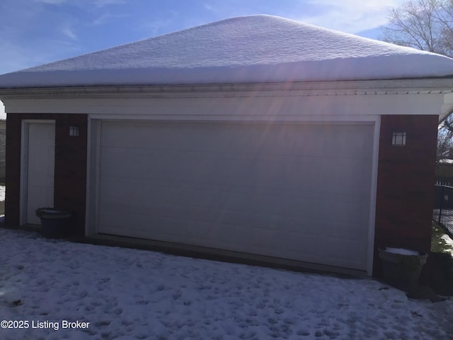 exterior space featuring a garage and an outdoor structure