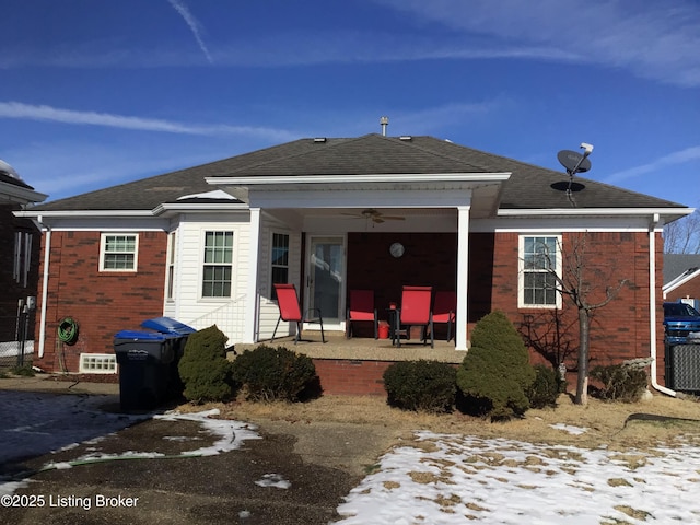 back of property with ceiling fan and a patio