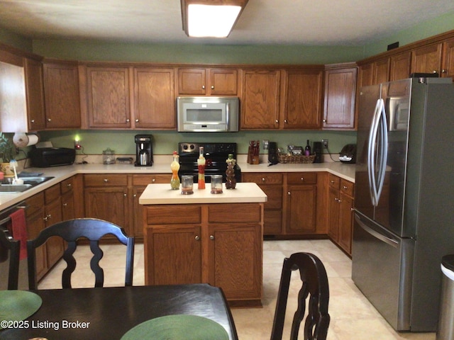 kitchen with sink and appliances with stainless steel finishes