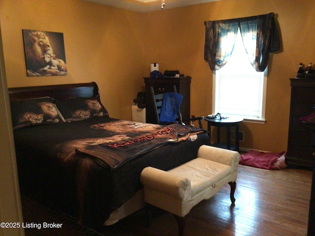 bedroom featuring hardwood / wood-style floors