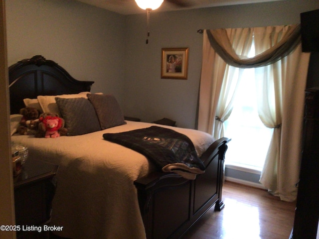 bedroom with hardwood / wood-style floors