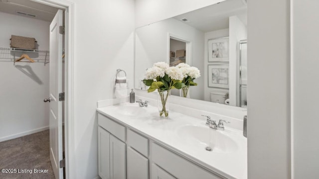 bathroom with toilet and vanity