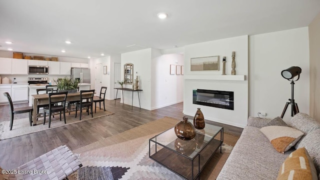 living room with dark wood-type flooring