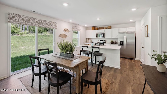 dining room featuring dark hardwood / wood-style flooring