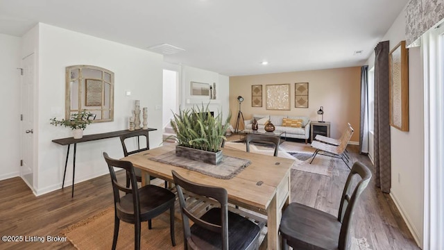 dining area featuring dark hardwood / wood-style flooring