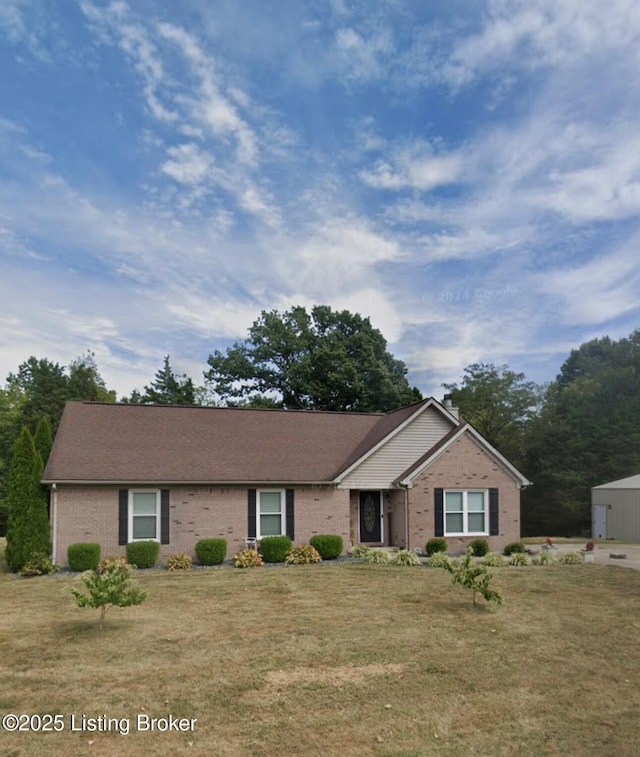 ranch-style home featuring a front yard