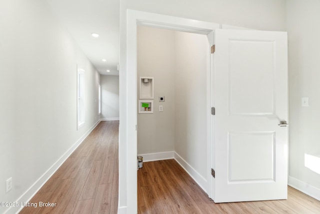 corridor featuring recessed lighting, light wood-style flooring, and baseboards