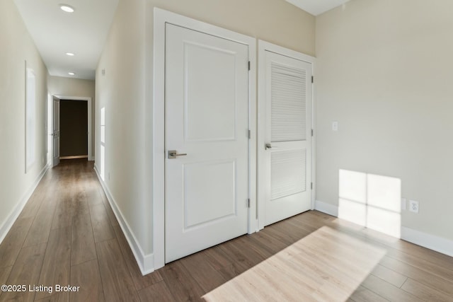 hall with recessed lighting, baseboards, and wood finished floors