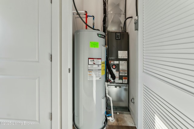 utility room with heating unit and electric water heater