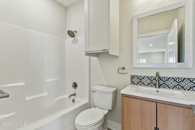 bathroom with shower / washtub combination, toilet, and vanity